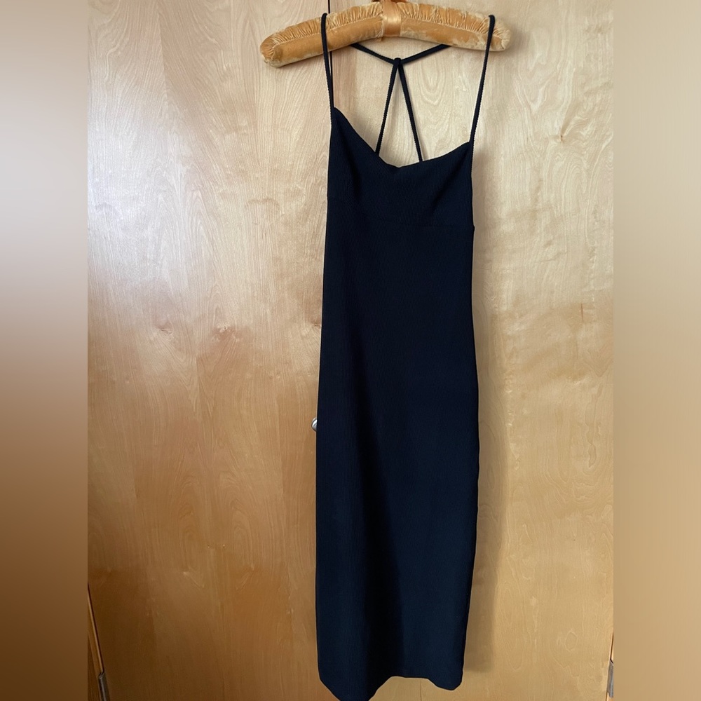 NWOT! Free People small black ribbed maxi dress. Unique back strap detail!